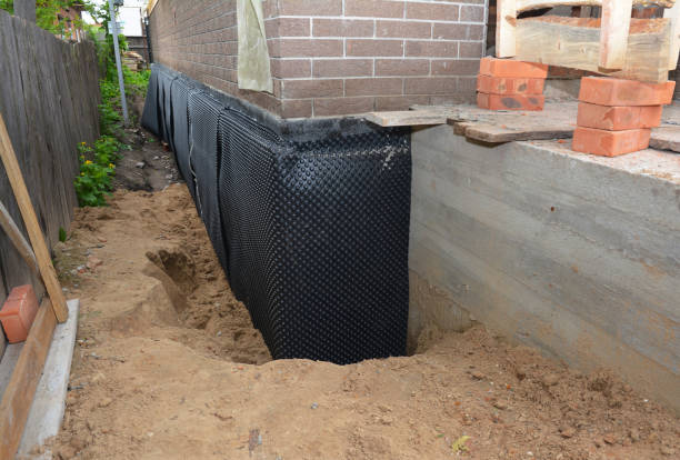 Happy homeowners after waterproofing job in Bloomville